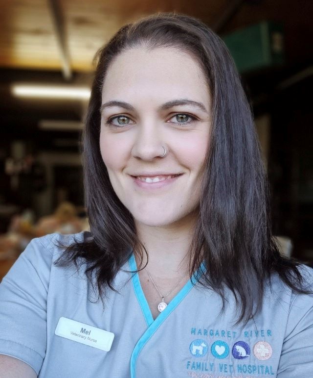 Mel smiling at camera.